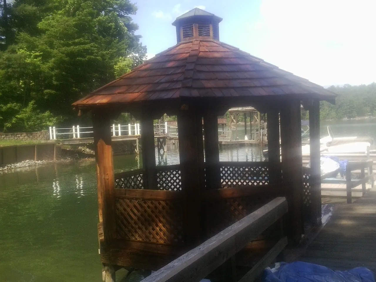 Cedar shake gazebo roof rebuilt on a lake dock in Hampton Falls